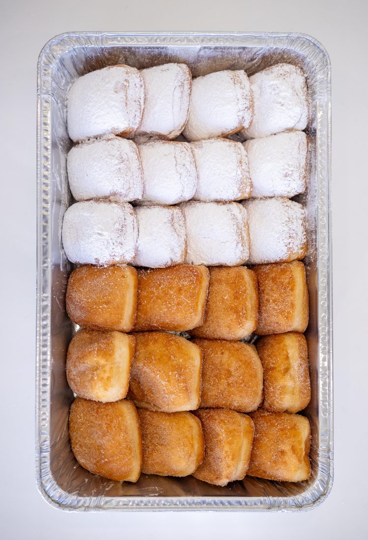 A box of fresh Thirst beignets ready for an event