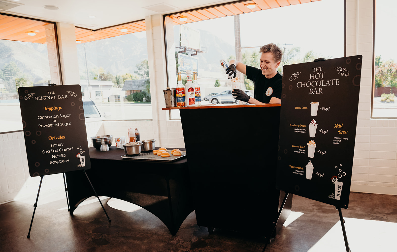 The Thirst Hot Chocolate Bar and Beignet Bar set up side by side